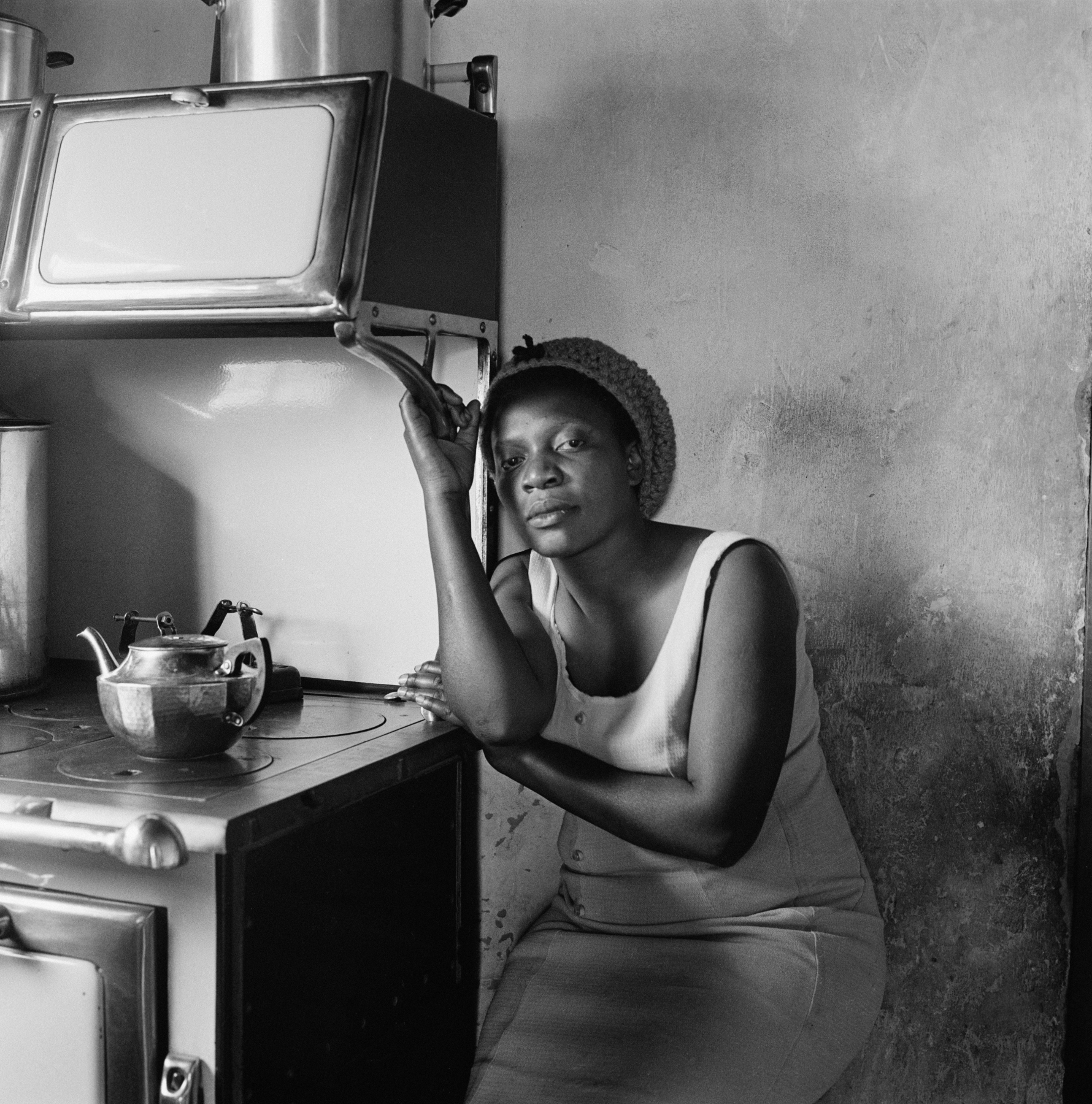 Patience Poni visiting her parents, Ruth and Jackson Poni, 1510A Emdeni South, Soweto,1972

Silver gelatin print on fibre-based paper

Image: 39.9 x 39.9 cm / 15.7 x 15.7 in.
AP 2/3
&nbsp;