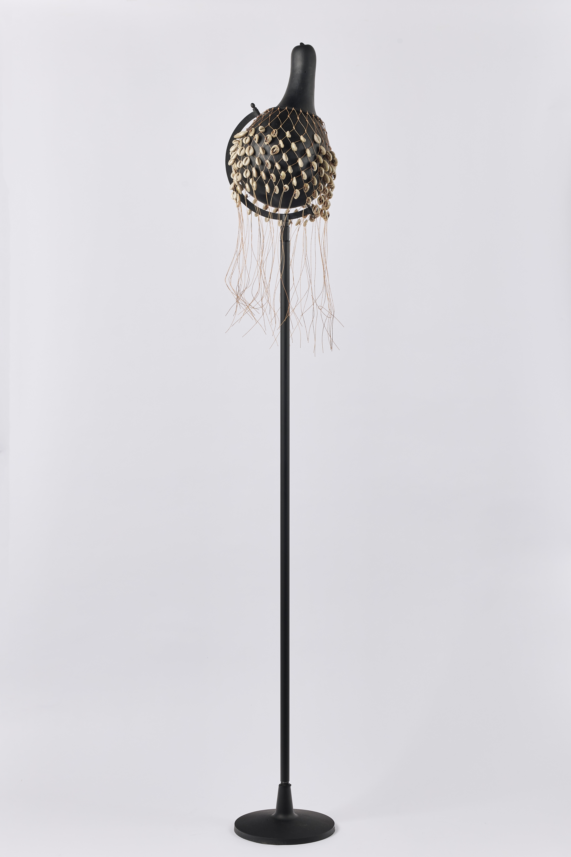 un voile with pillar

2021

altered calabash, black primer, cowry shell veil on steel and aluminium stand

167.5 x 27.2 x 27.2 cm

sales enquiries

&nbsp;